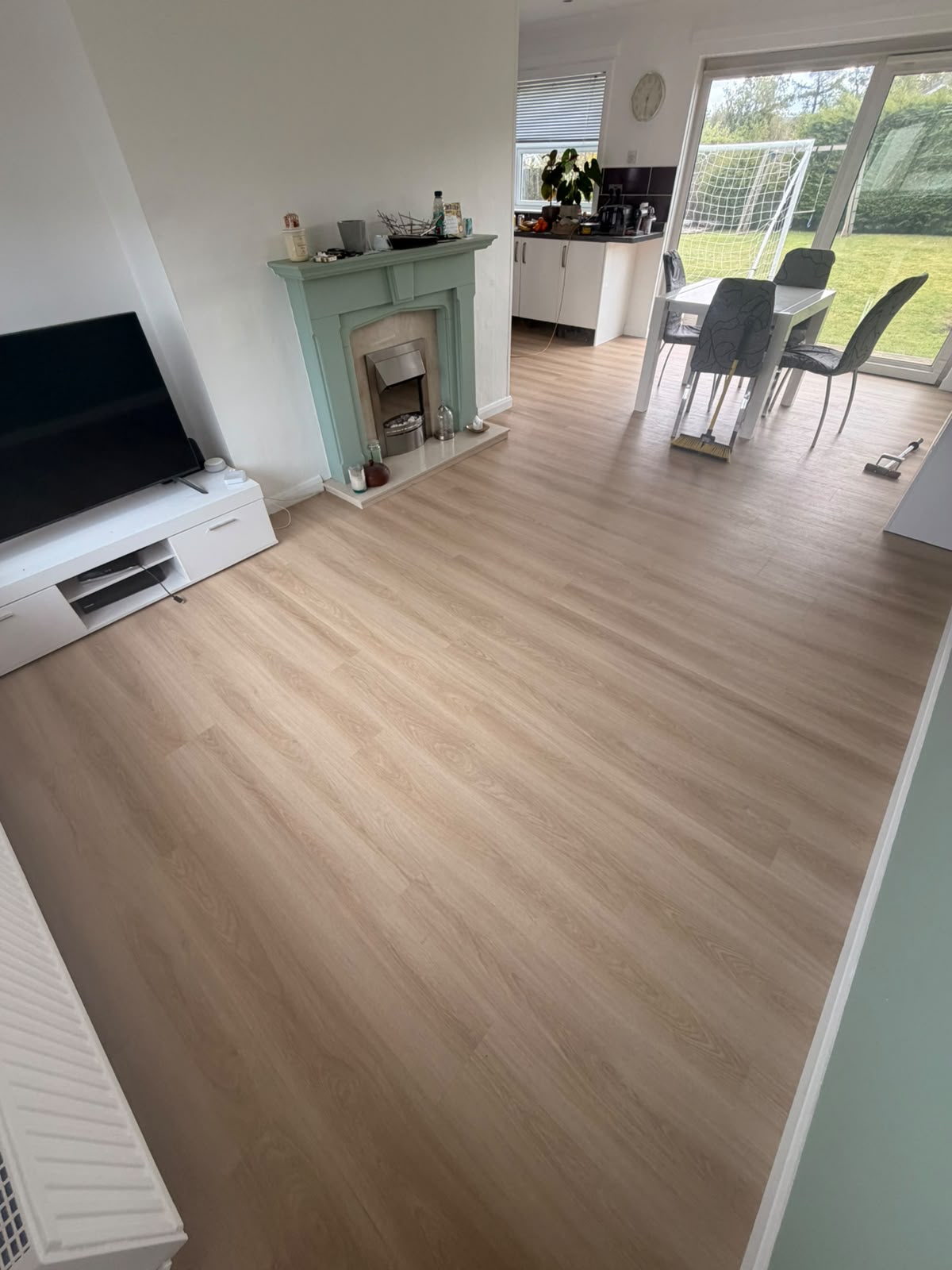 Light oak LVT running through an open-plan lounge, diner and kitchen