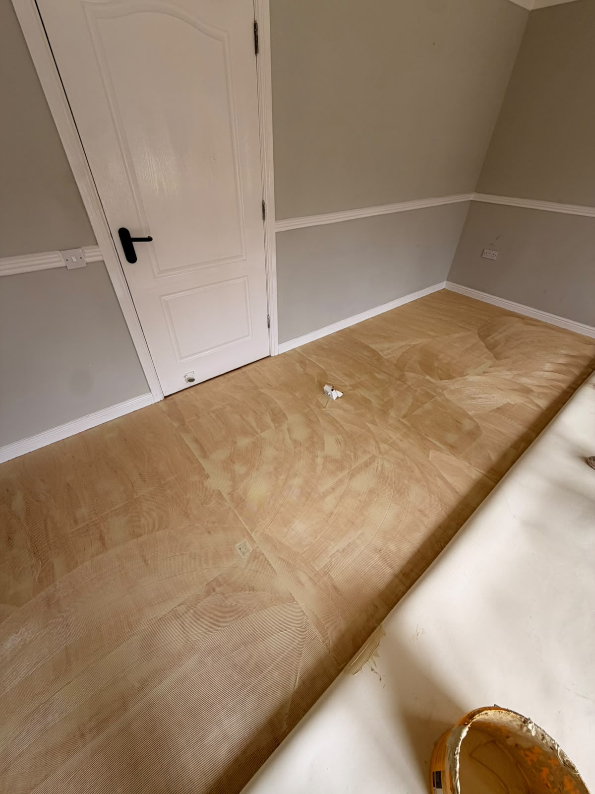 Smoothing compound trowelled over ply